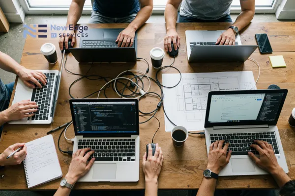 working environment with employees working on their laptops