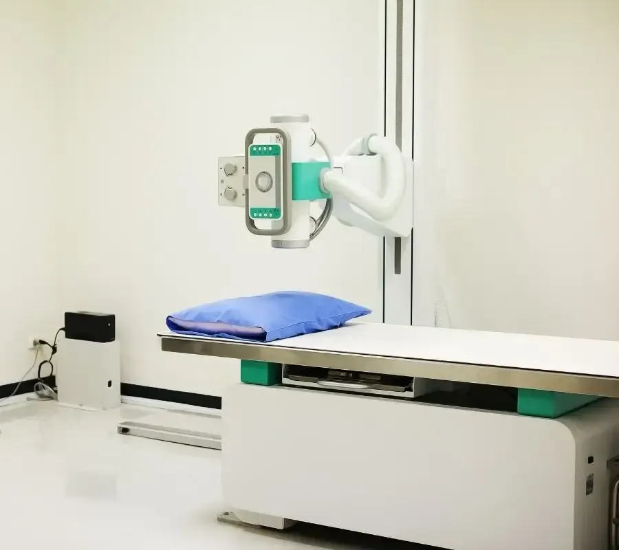 Modern medical imaging room with X-ray equipment and exam table, representing Centurion Insurance Services’ business insurance offerings tailored for healthcare facilities.