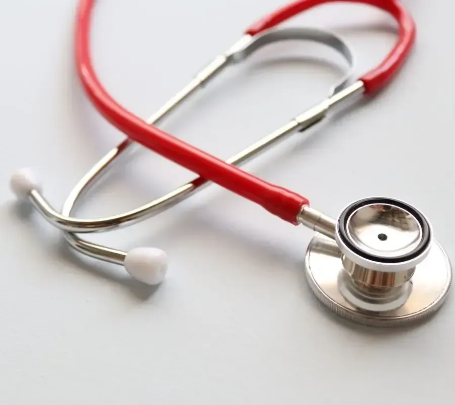 Red stethoscope on a white background, symbolizing Centurion Insurance Services’ specialized coverage for healthcare providers and medical facilities.
