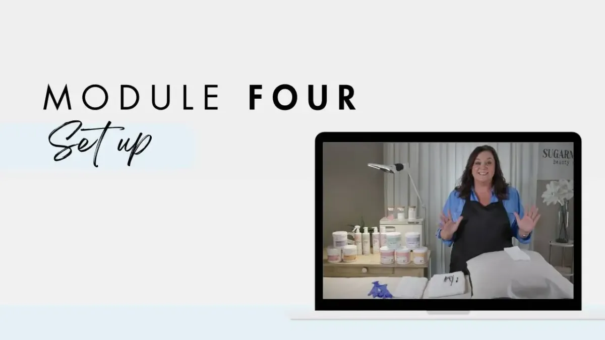 Woman demonstrating sugaring setup in a treatment room, surrounded by skincare products, with text overlay "MODULE FOUR Set up," emphasizing training in body sugaring techniques.