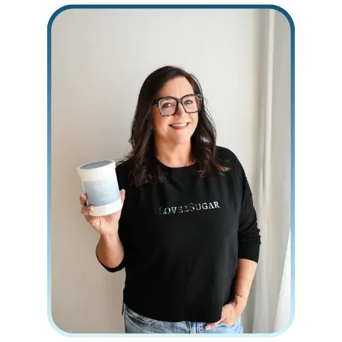 Shannon in black shirt holding love2sugar collection product