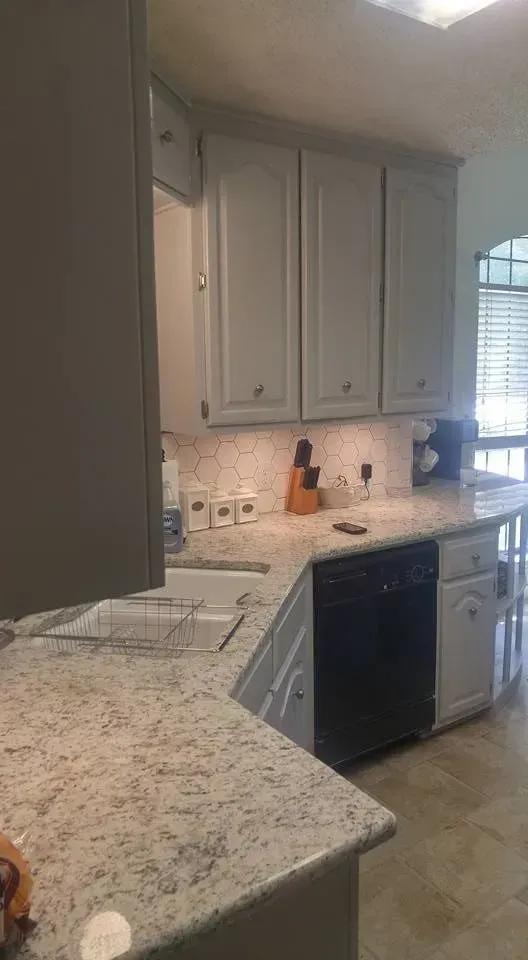 New kitchen remodel with granite counters and tile backsplash