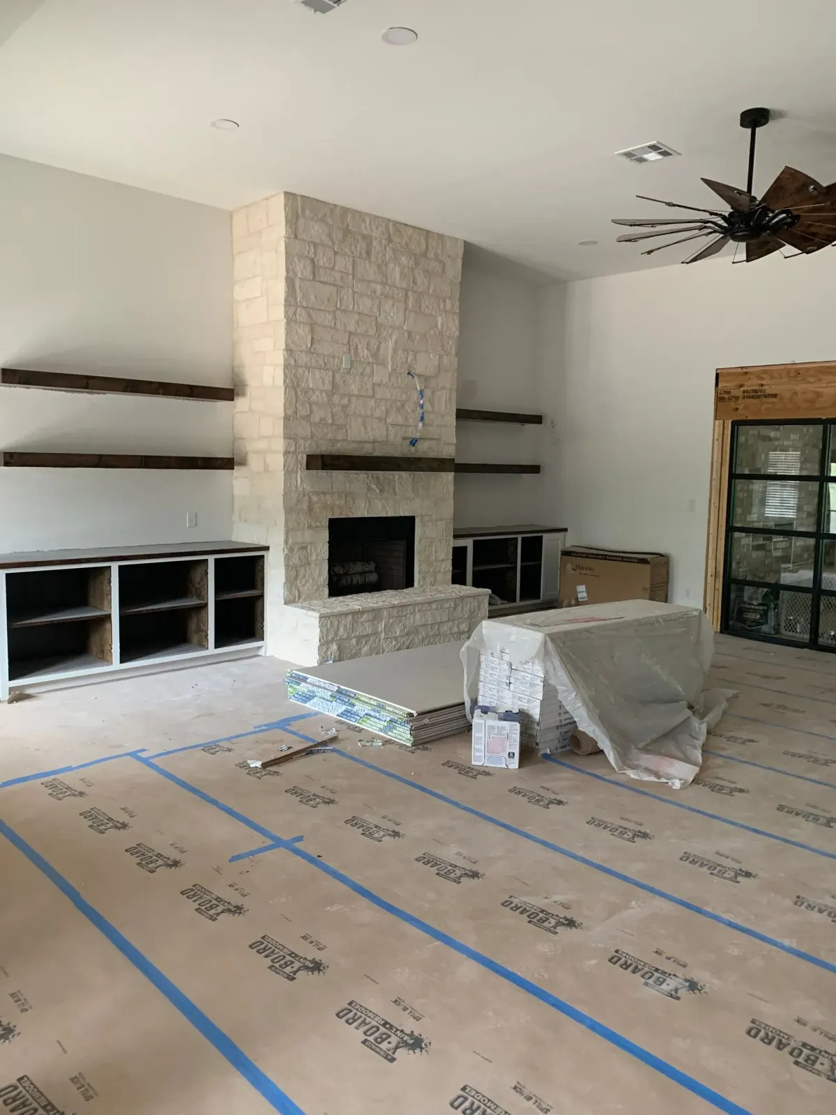 Living room remodel process with materials on the floor