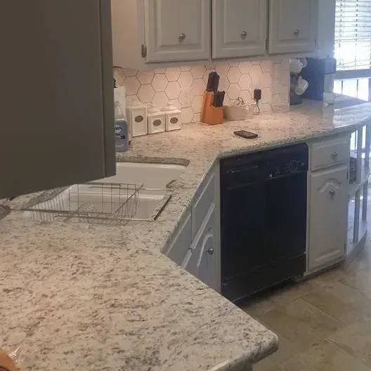 New kitchen remodel with granite counters and tile backsplash