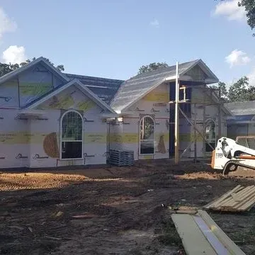 New custom home build with equipment outside of home