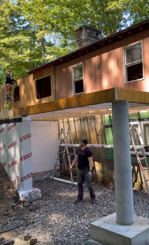 Gutters rolling out of truck being cut to size