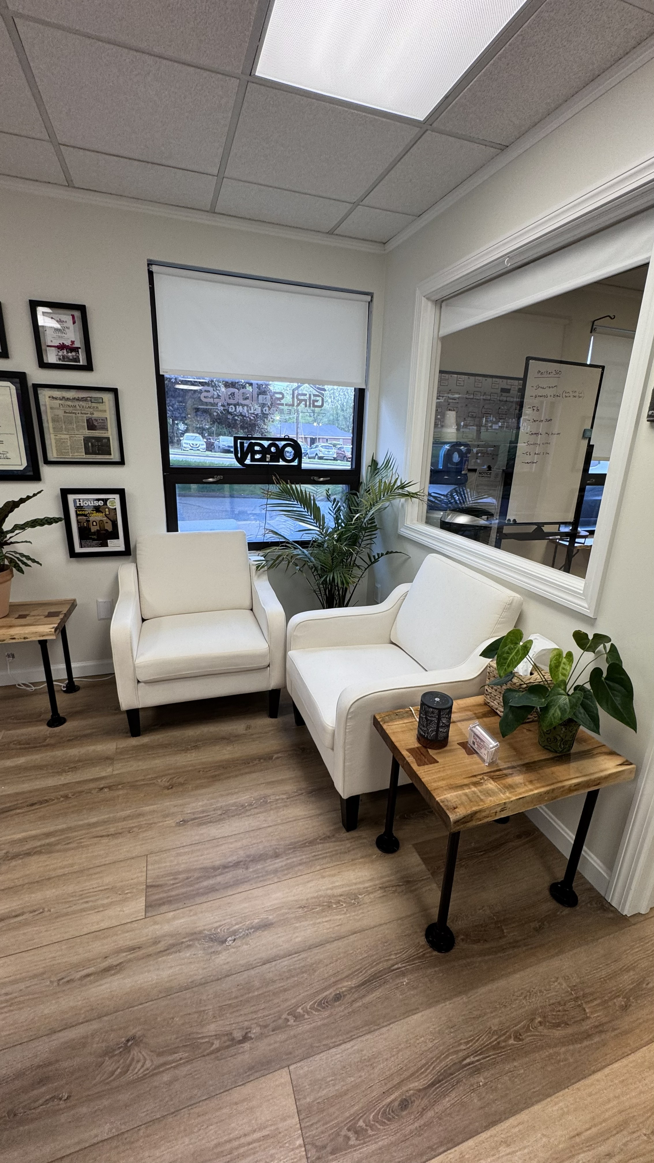 Office waiting area with wood flooring and seating chairs