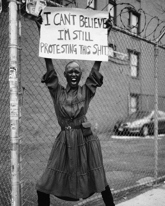 A diverse group of women laughing together in a sunlit park, each expressing unique style and joy, symbolizing authentic connection and empowerment.