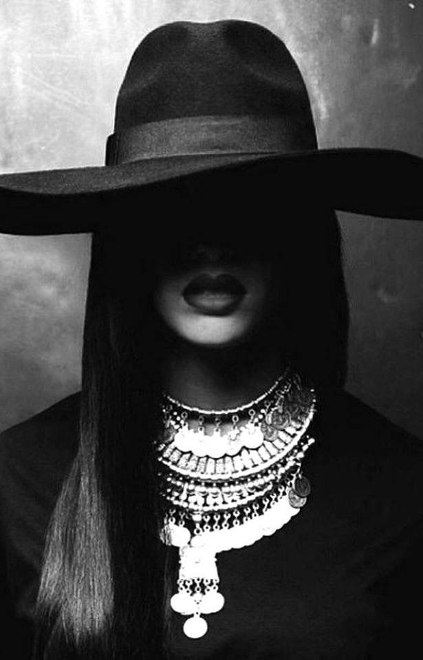 A diverse group of women laughing together in a sunlit park, each expressing unique style and joy, symbolizing authentic connection and empowerment.