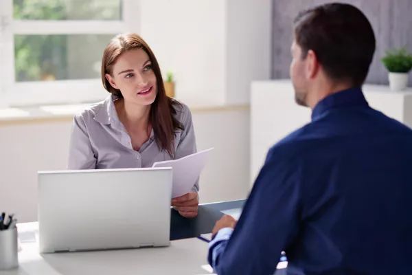 woman talking to business man