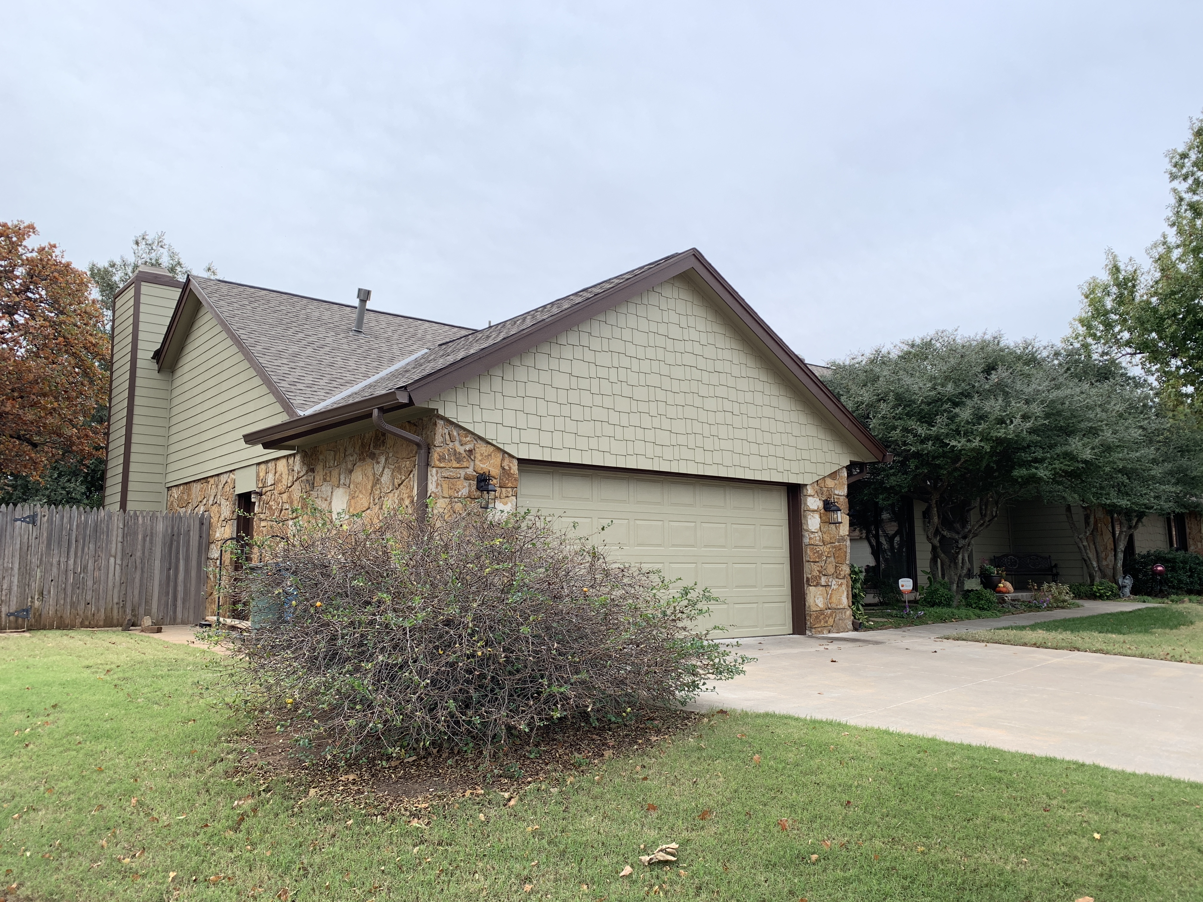 Residential roof replacement completed by 123 Remodeling LLC in Oklahoma City, OK using asphalt shingles