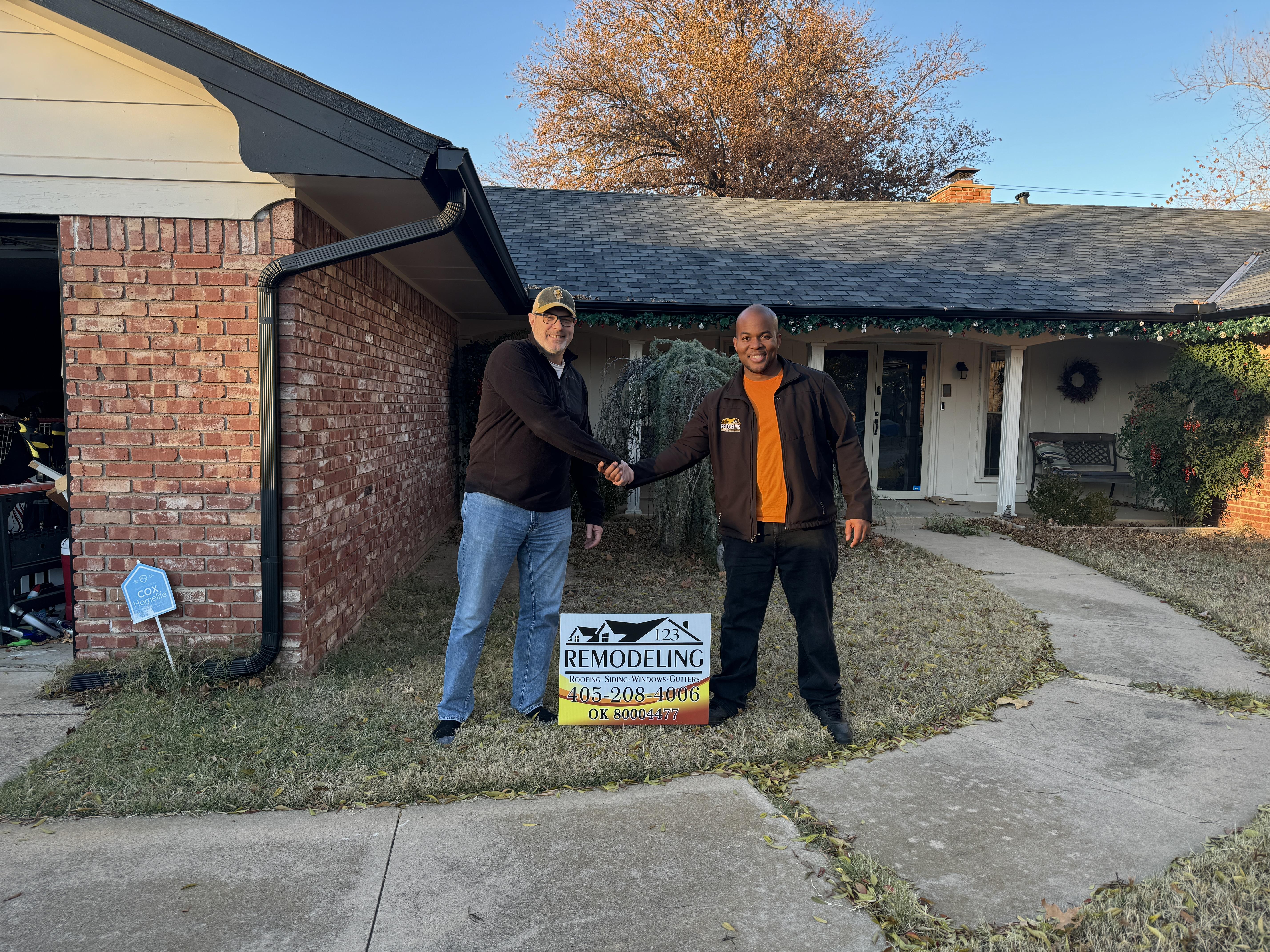 Satisfied homeowner in Oklahoma City with 123 Remodeling LLC after completing a roof replacement