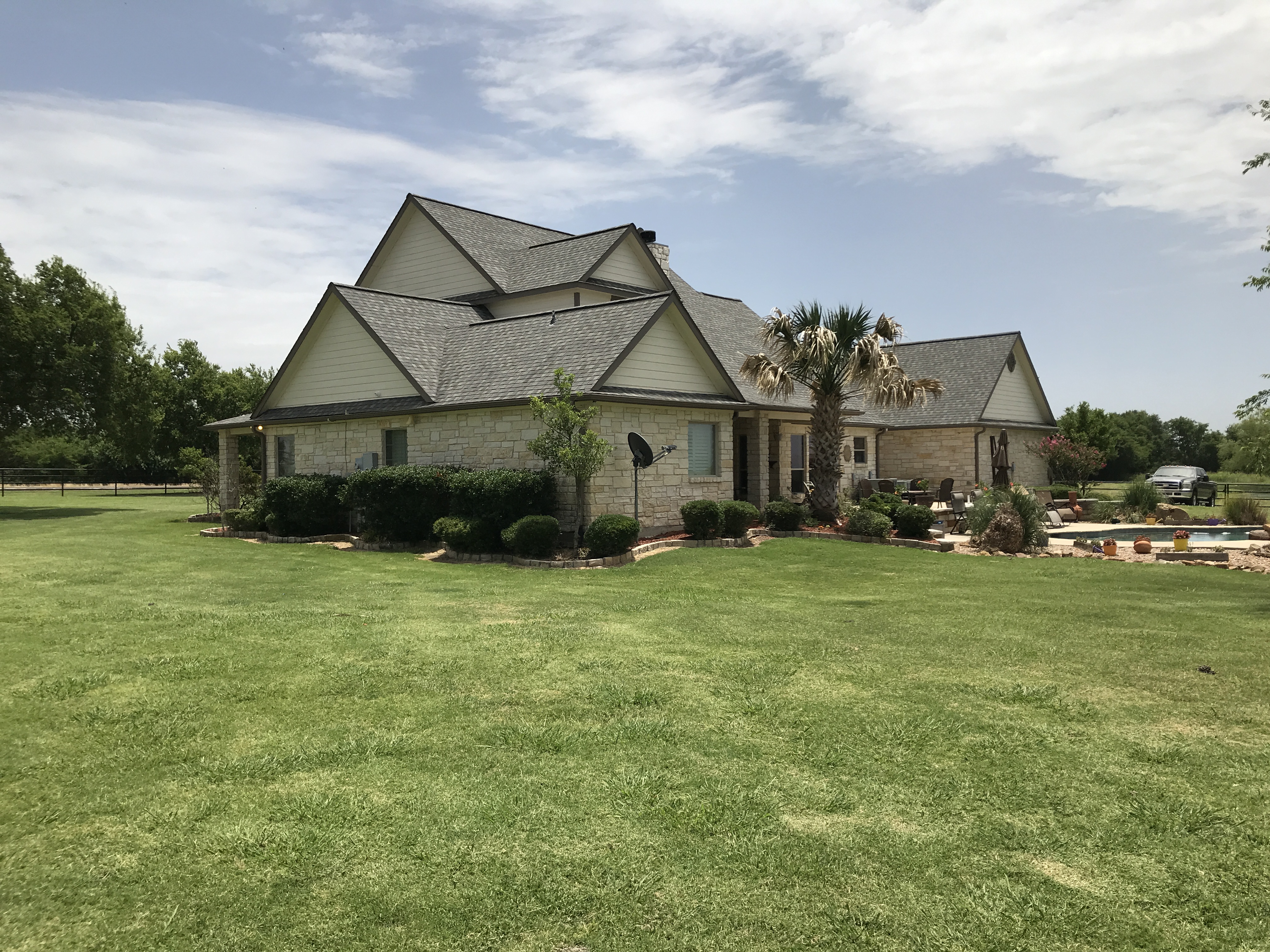 Completed asphalt shingle roof replacement on a residential home in Oklahoma City by 123 Remodeling LLC