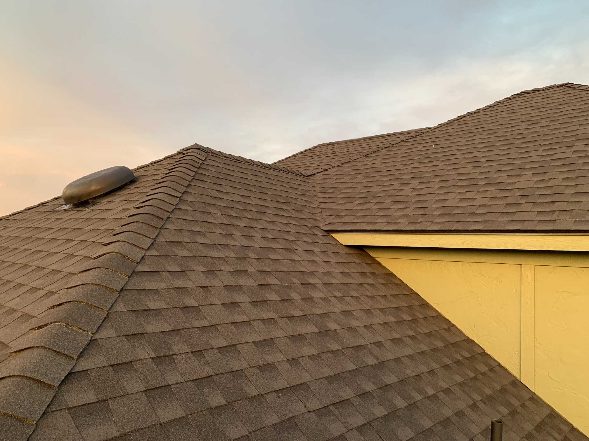 Finished asphalt shingle roof with clean valleys and transitions installed by 123 Remodeling LLC in Oklahoma City
