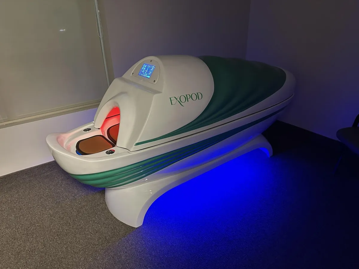 Woman meditating in lotus pose on yoga mat