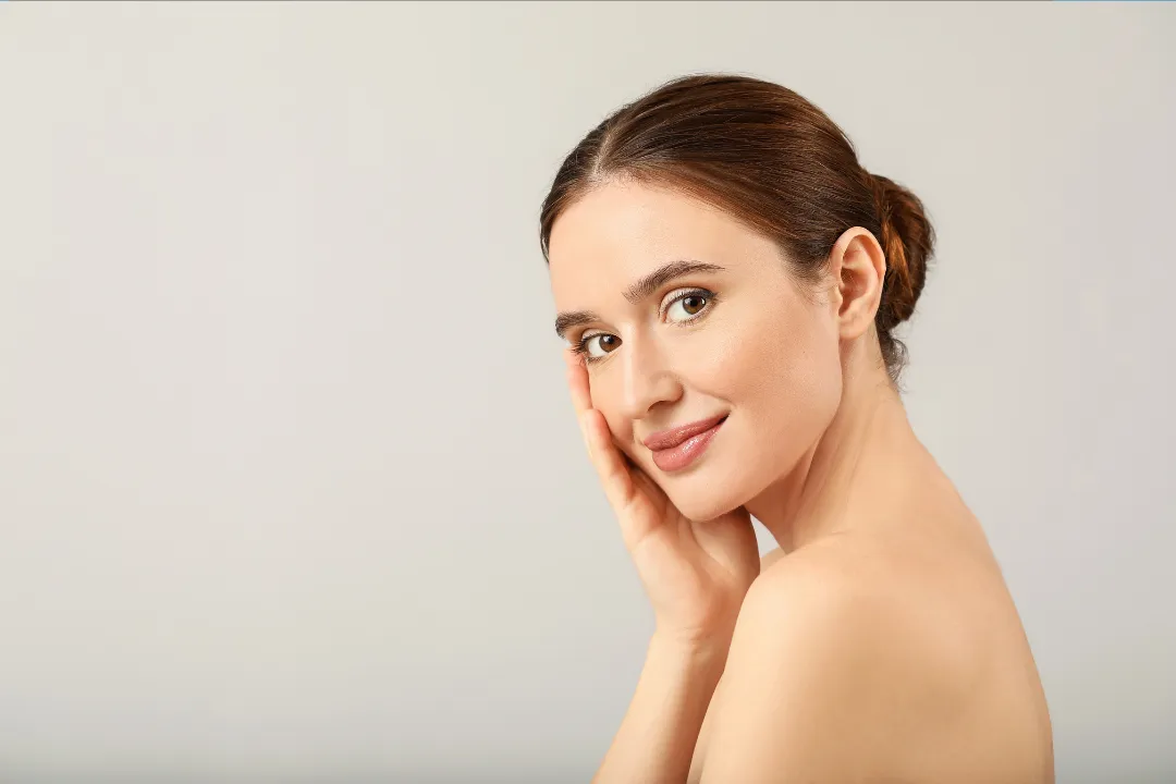 clear glass bottle with red lid