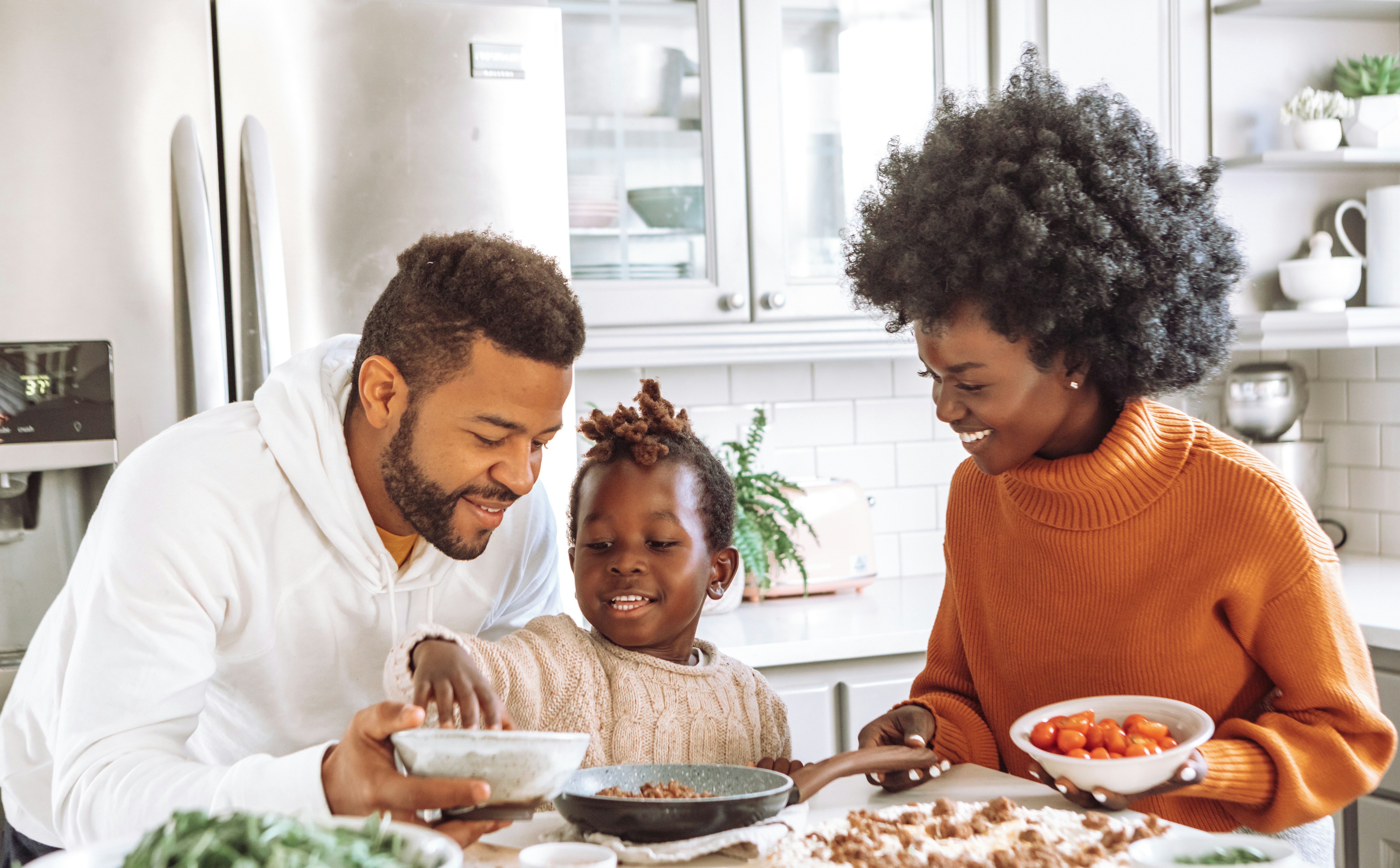 A group of people sitting around a table full of food