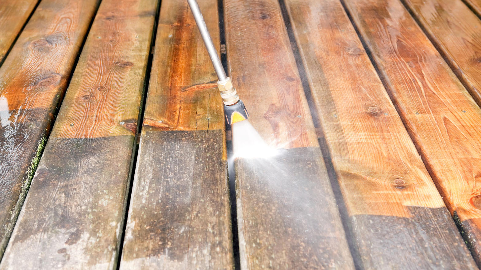 Pressure washing a wood deck in Aurora, CO