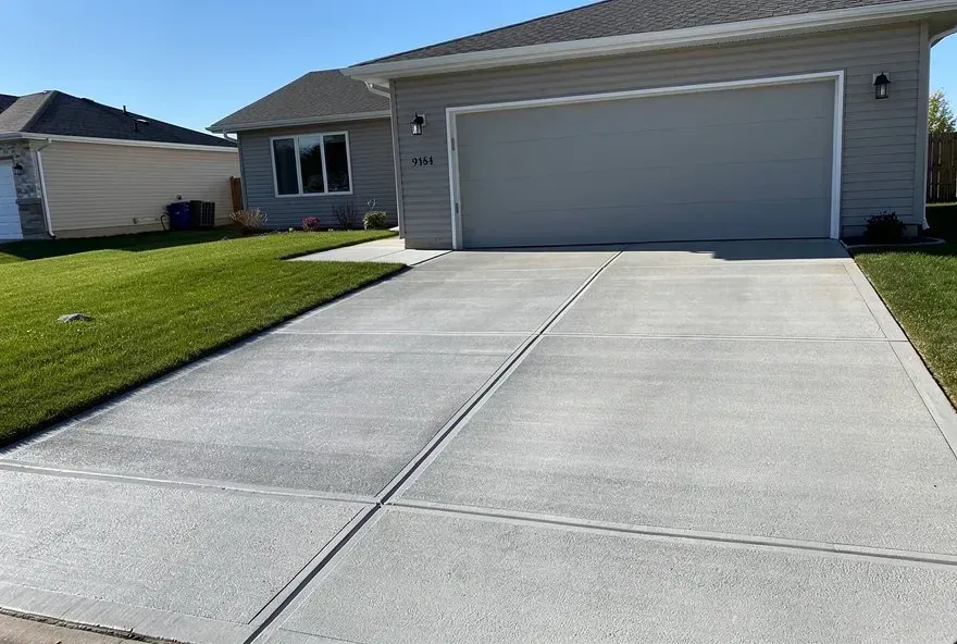 Newly finished concrete driveway attached to garage at a Warrensville Heights, Ohio home.