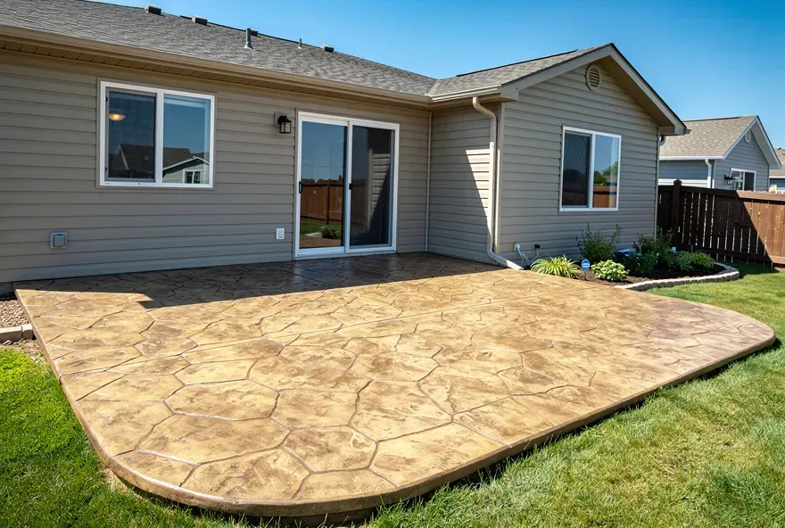 Stamped concrete patio with stone-pattern finish installed at a home in Warrensville Heights, Ohio.
