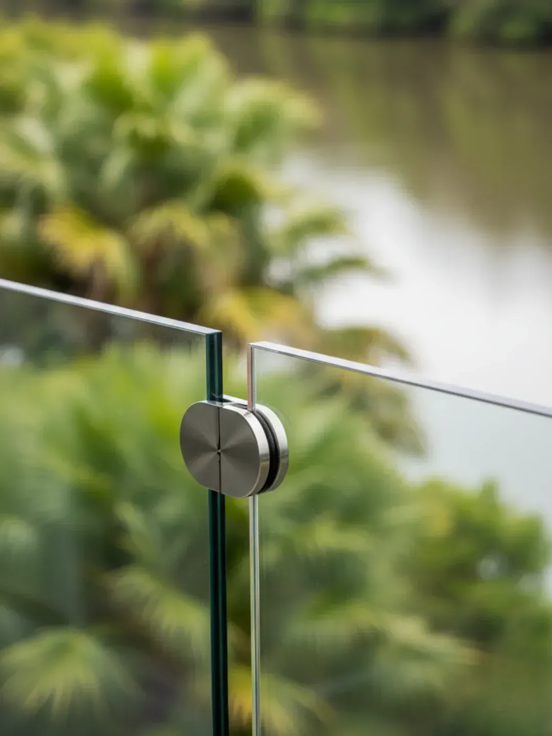 Inner-north Brisbane river humidity considerations for glass balustrade hardware in Teneriffe apartment balcony