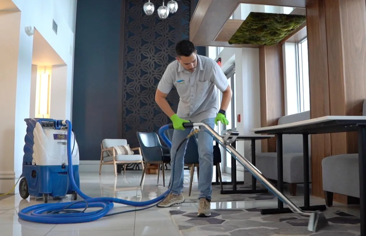FBM Cleaning technician professionally cleaning a residential carpet in Boulder County, Colorado.