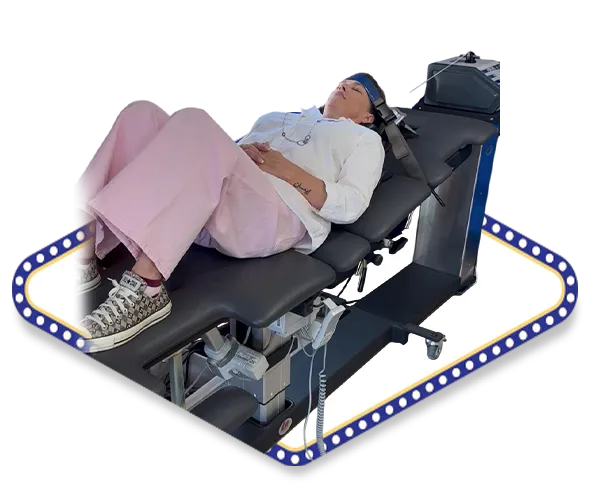 Female chronic pain patient receiving cervical spinal decompression therapy for fibromyalgia relief at Dr. Dale Kimberlin's advanced chiropractic clinic in Ankeny Iowa.
