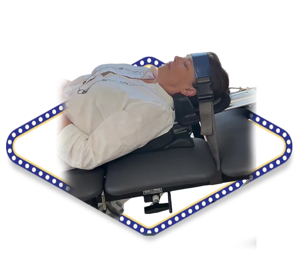 Female auto accident injury patient receiving cervical spinal decompression therapy for whiplash treatment at Dr. Dale Kimberlin's Ankeny Iowa chiropractic clinic.