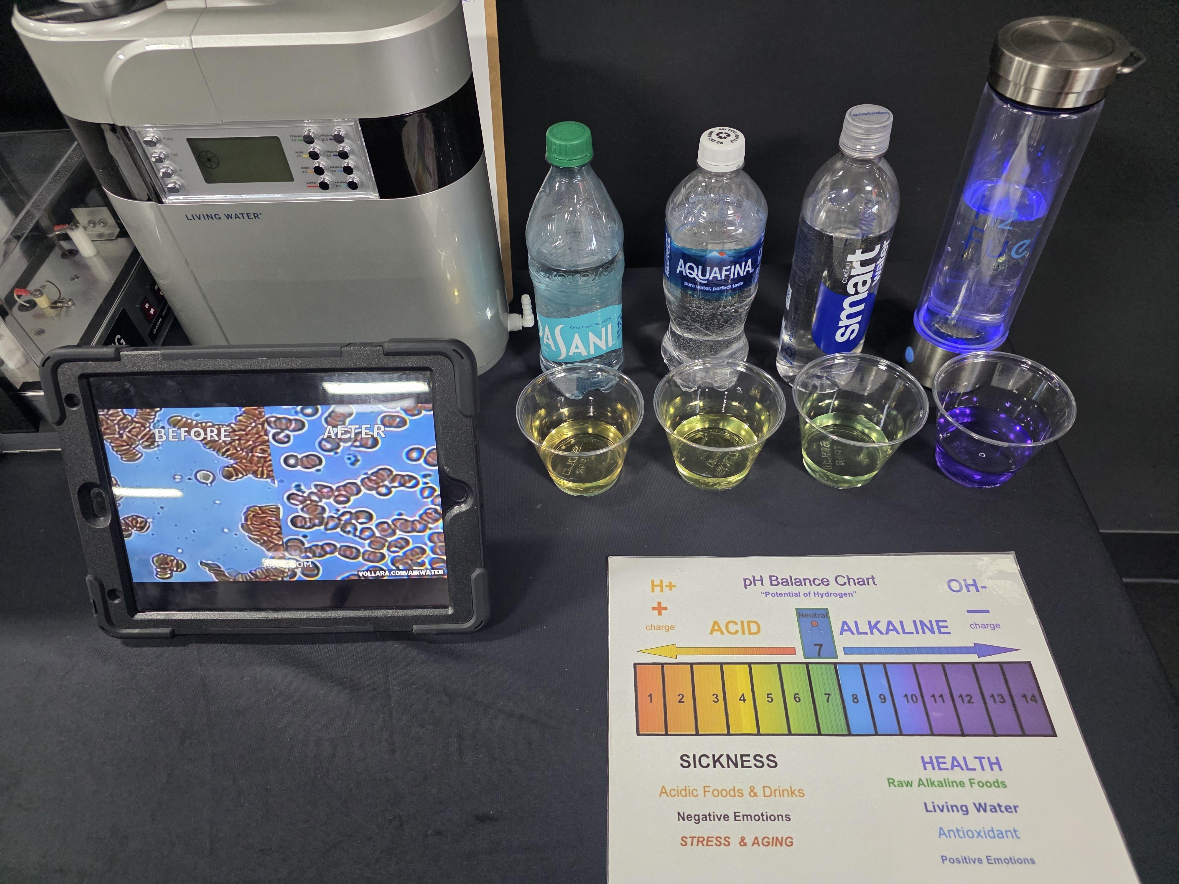 person holding gray sports bottle near nozzle