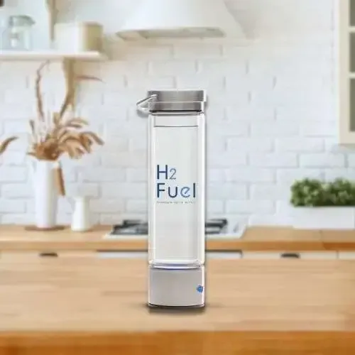 a hand holding a starbucks drink with a green straw