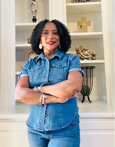 Course creator smiling softly with warm feminine background