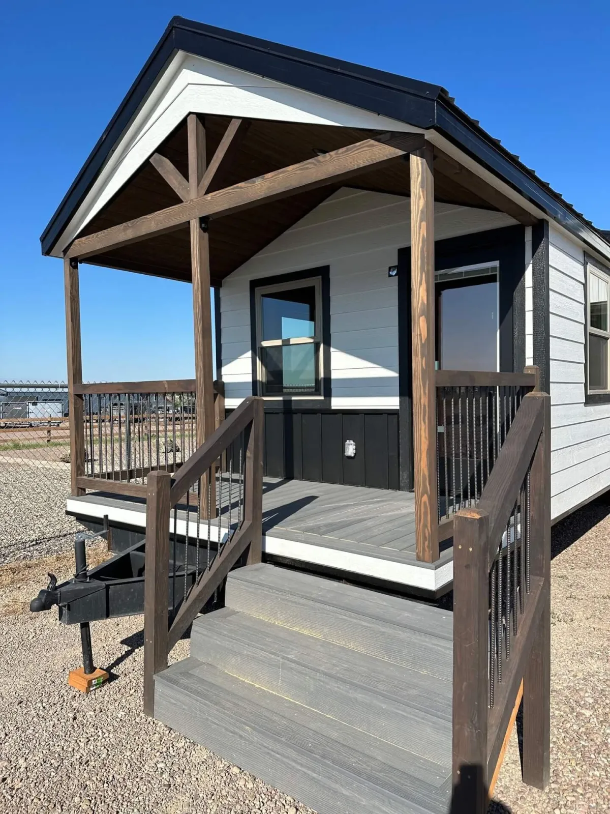 Exterior photo of 1889 park model RV with a porch