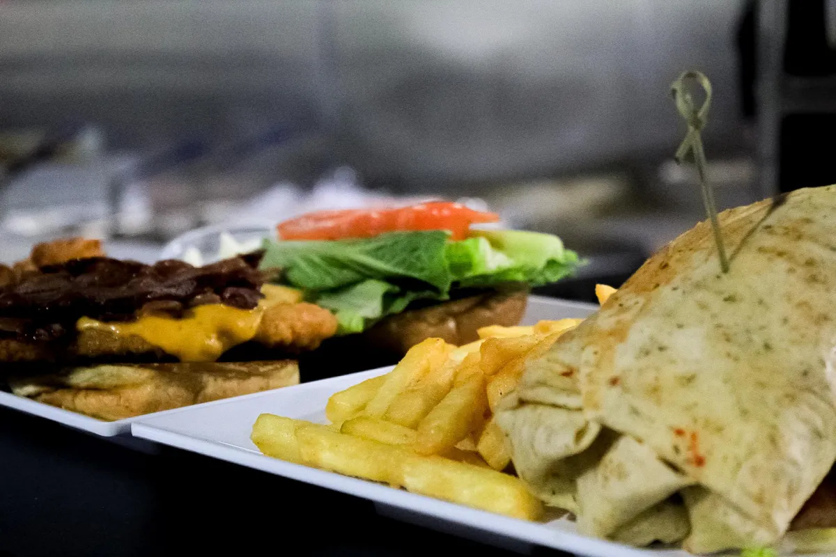 A burger, wrap, and french fries from City Eats in Action City