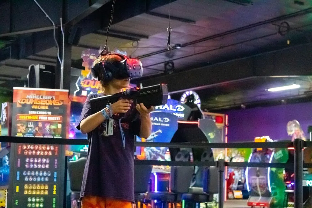 A kid playing virtual reality in Action City