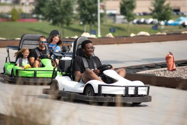 Guests racing the outdoor go-karts in Action City