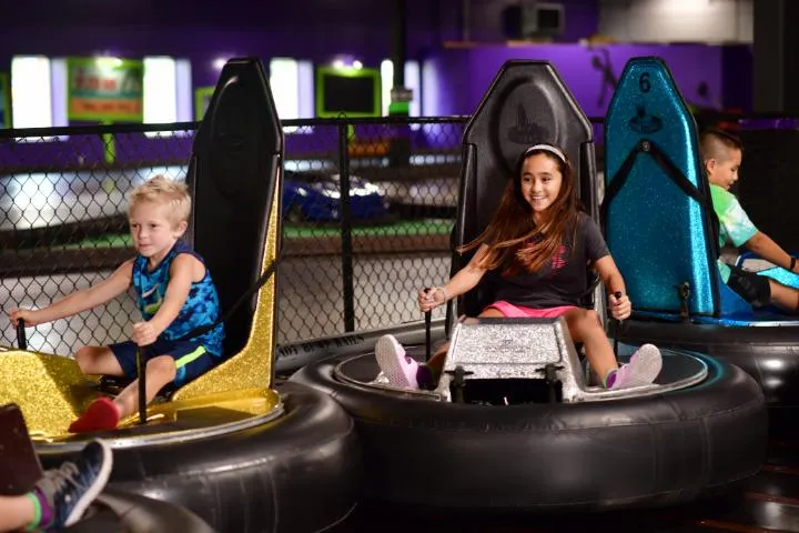 Kids riding the bumper cars in Action City