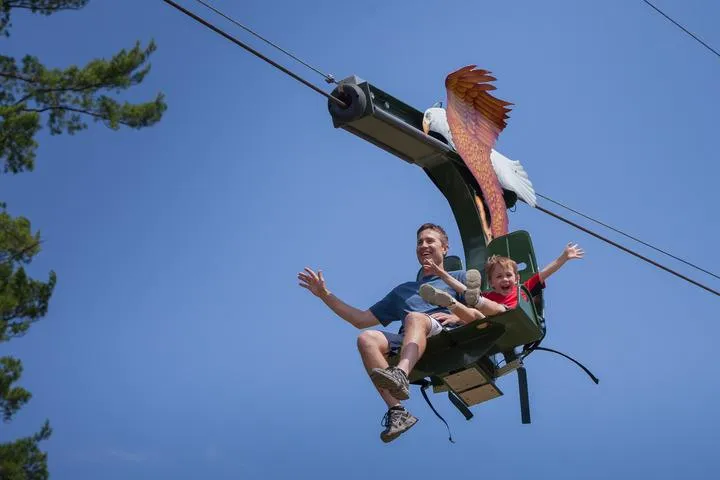 Guests riding the zipline at Action City