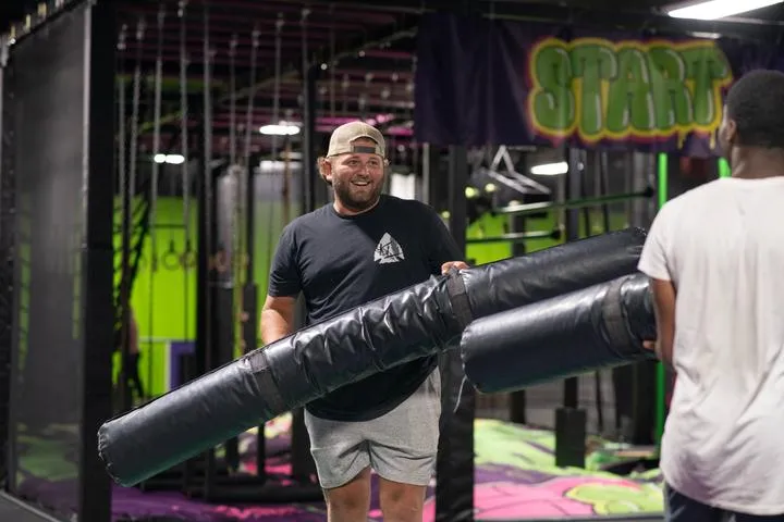 People jousting in Action City's trampoline park