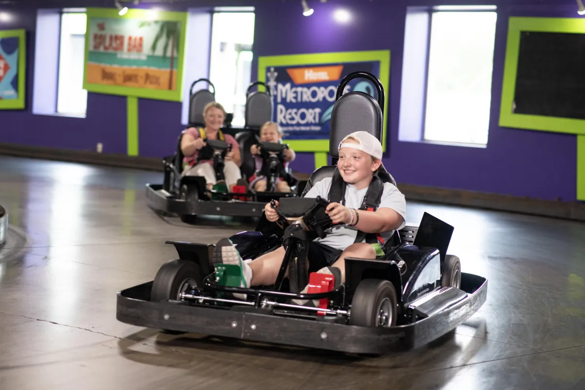 People racing the indoor go-karts at Action City