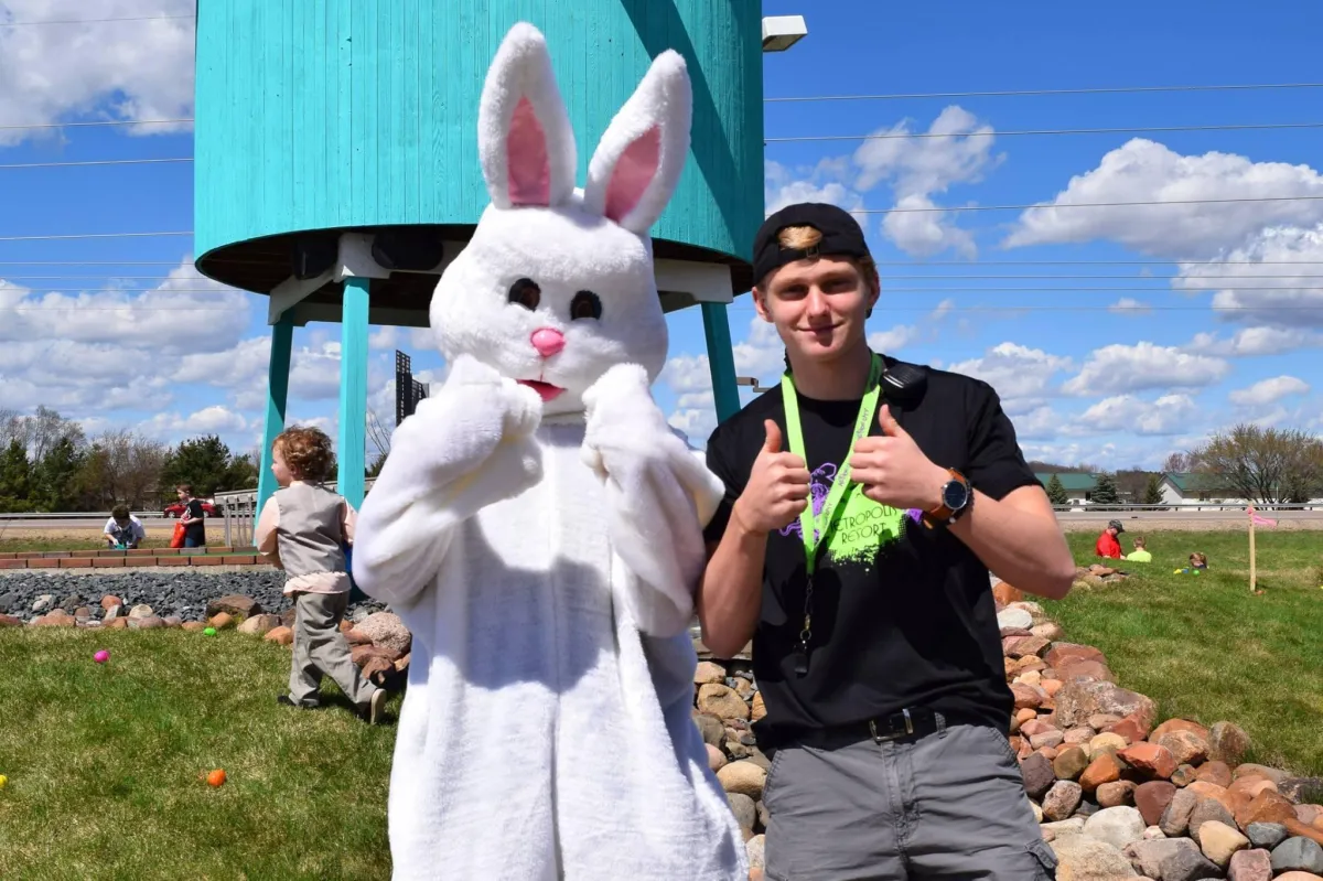 Metropolis Resort employee posing with the Easter Bunny