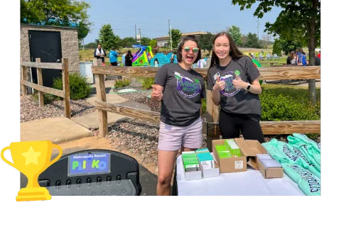 Action City employees giving out prizes in Chaos Water Park's backyard