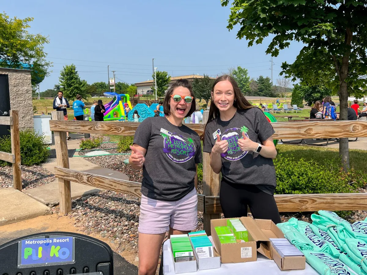 Metropolis Resort Employees giving out prizes in Chaos Water Park's backyard