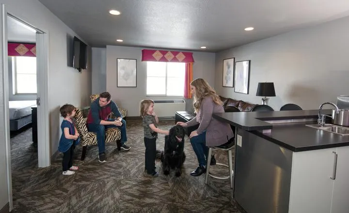 A family staying in a hotel room at Metropolis Resort