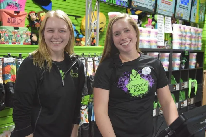 Employees working at the front desk in Action City