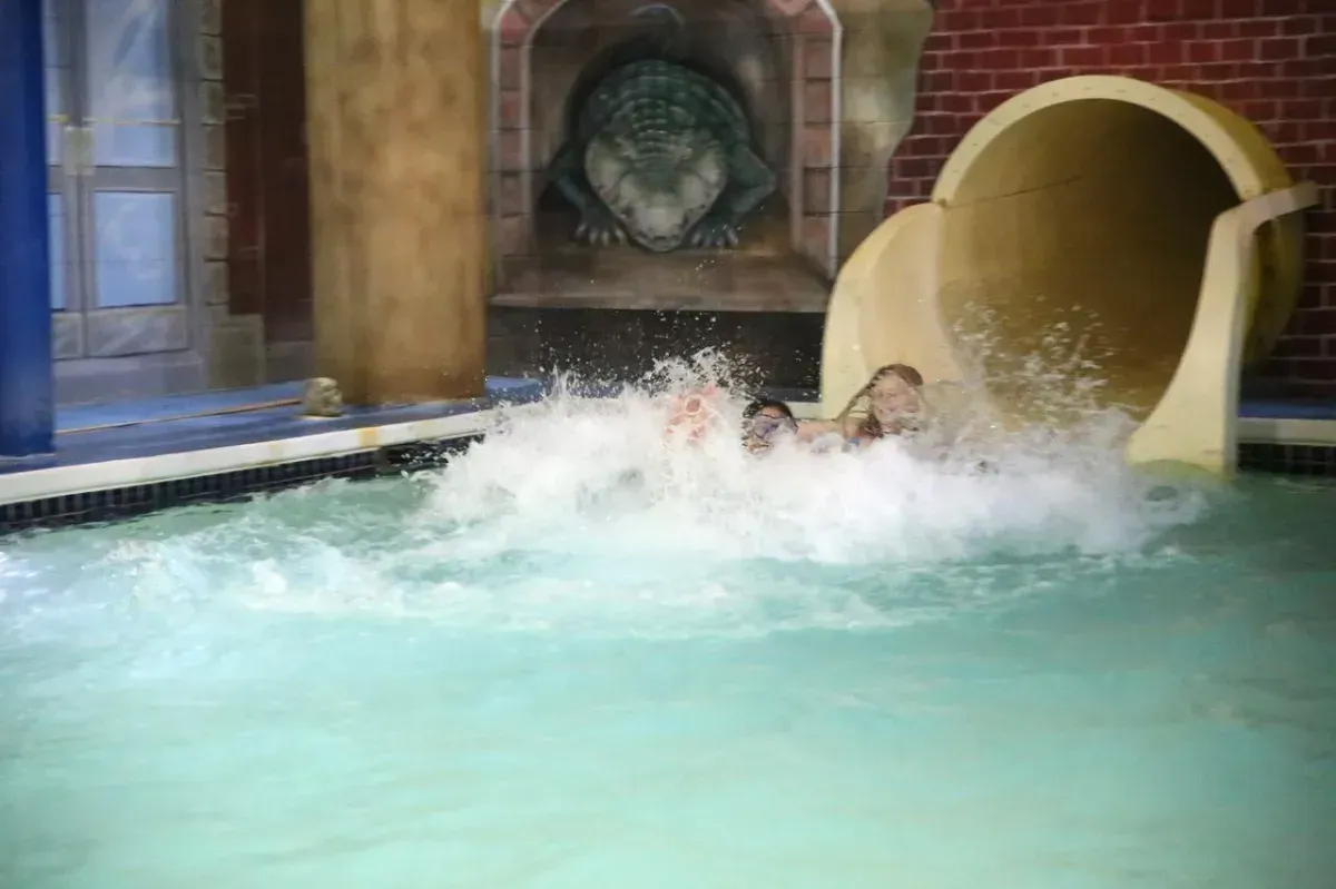 Guests in a double tube at the Hurricane Run Water Slide in Chaos Water Park