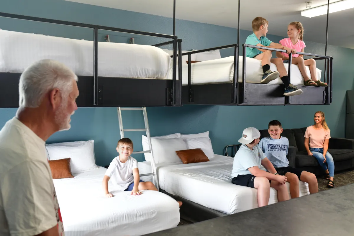 Girl splashing in the Chaos Water Park aquatic playground.