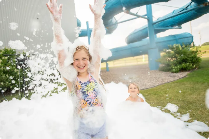Kids playing in foam in Chaos Water Park's backyard