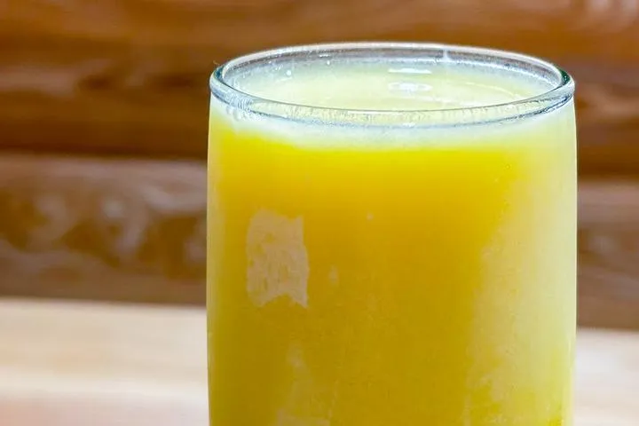 City Eats Orange Creamsicle Mimosa with orange juice, heavy cream, simple syrup, and topped with champagne.