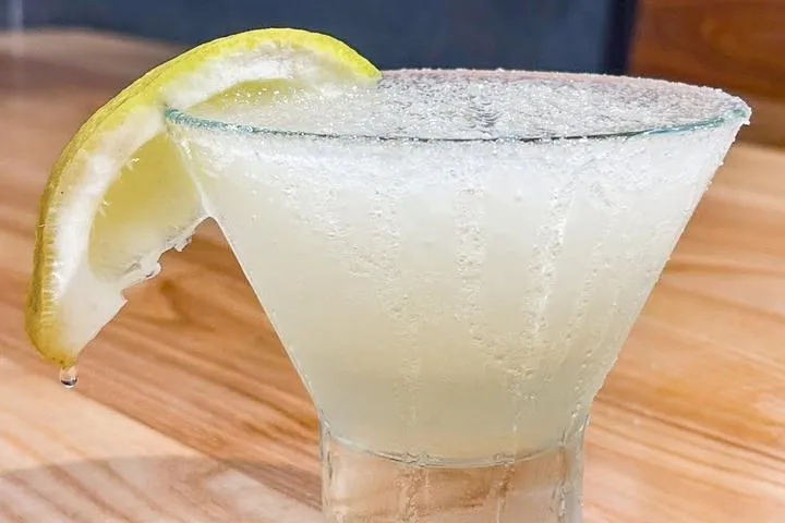 City Eats Lemon Drop cocktail with Patron Tequila, Cointreau, lemonade, lemon juice, blended with a sugar rim.