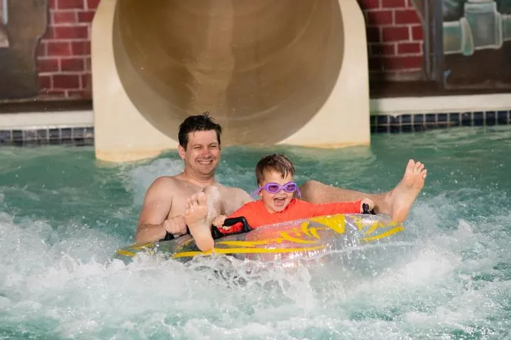 Guests riding the Hurricane Run Water Slide in Chaos Water Park